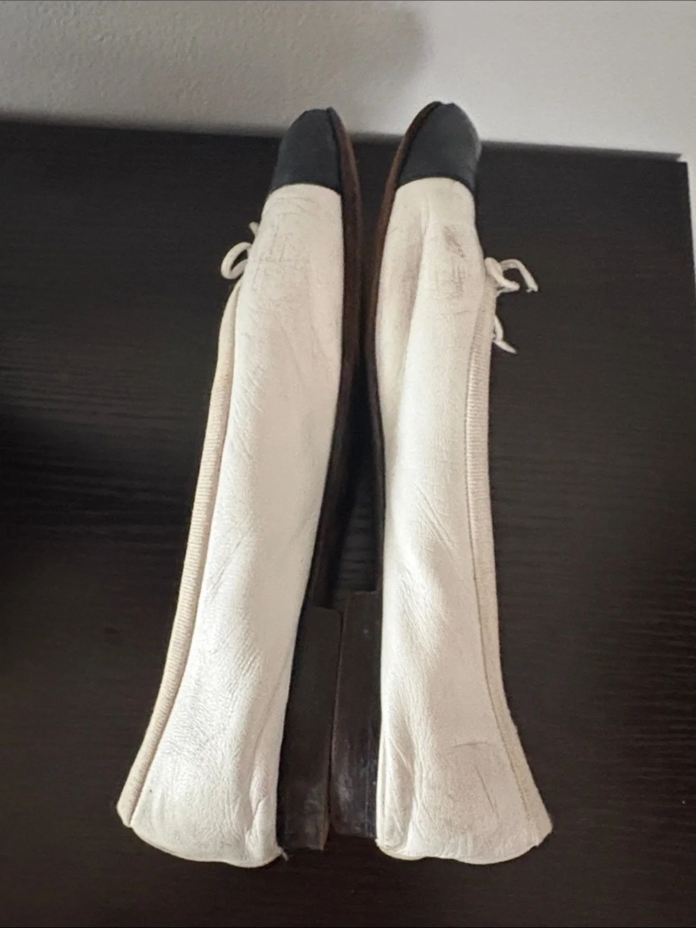 CHANEL White Leather Ballet Flats with Black Cap Toe and Bow
